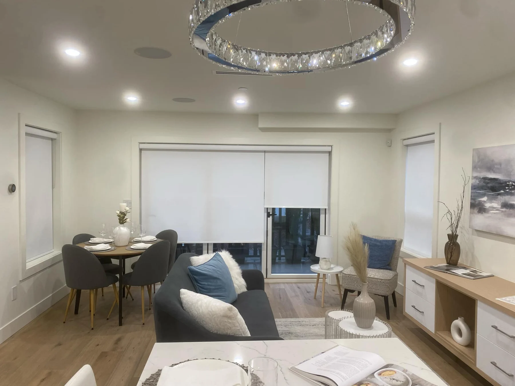 Bright living and dining room with fitted window shades