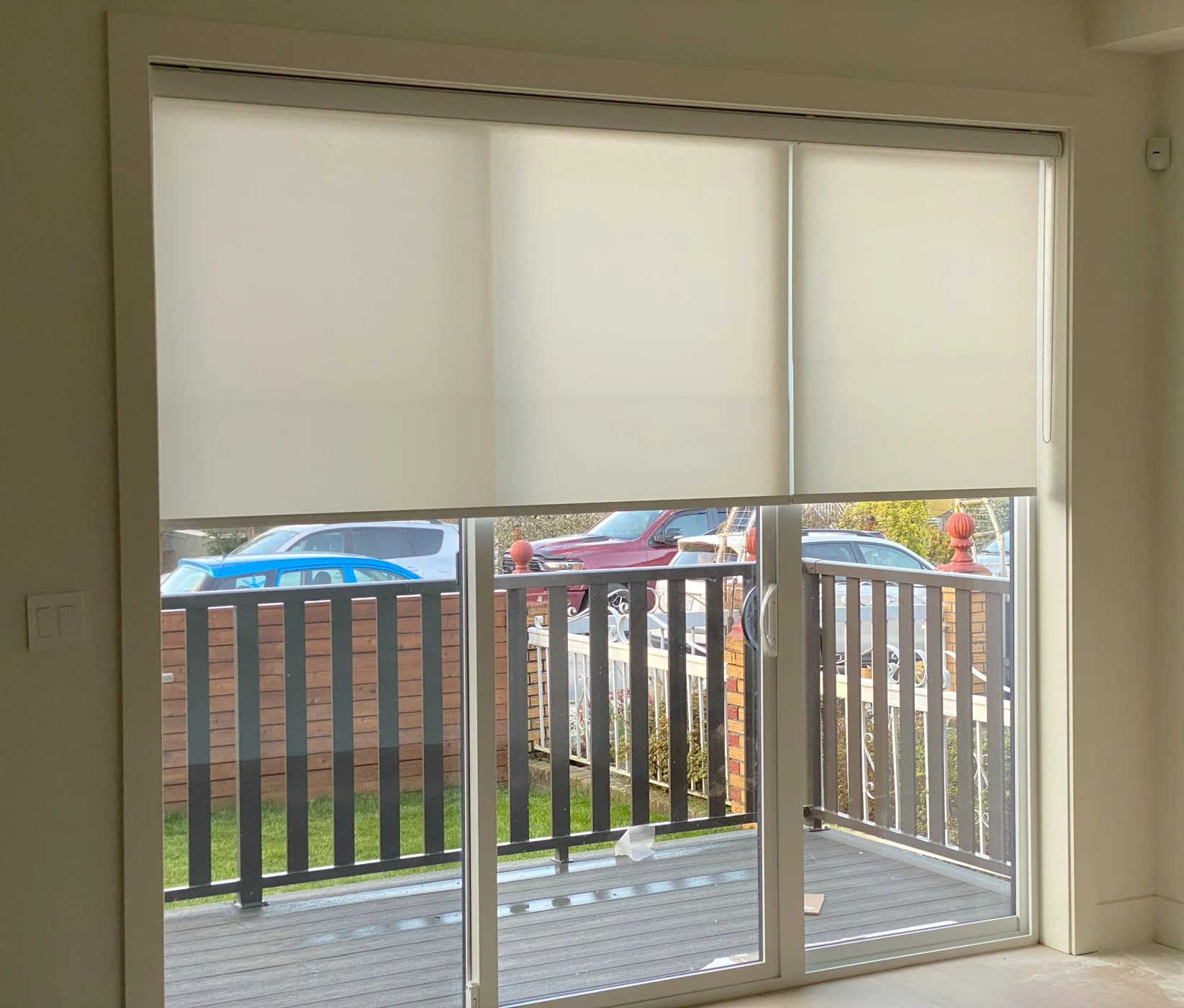 Roller shades fitted to a wide window